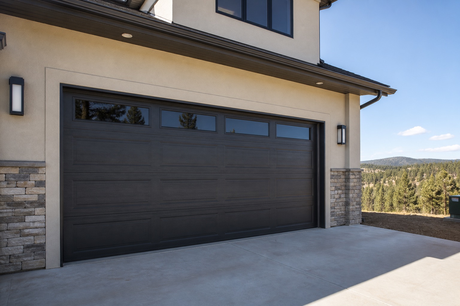 New dark insulated garage door on a Black Hills area home